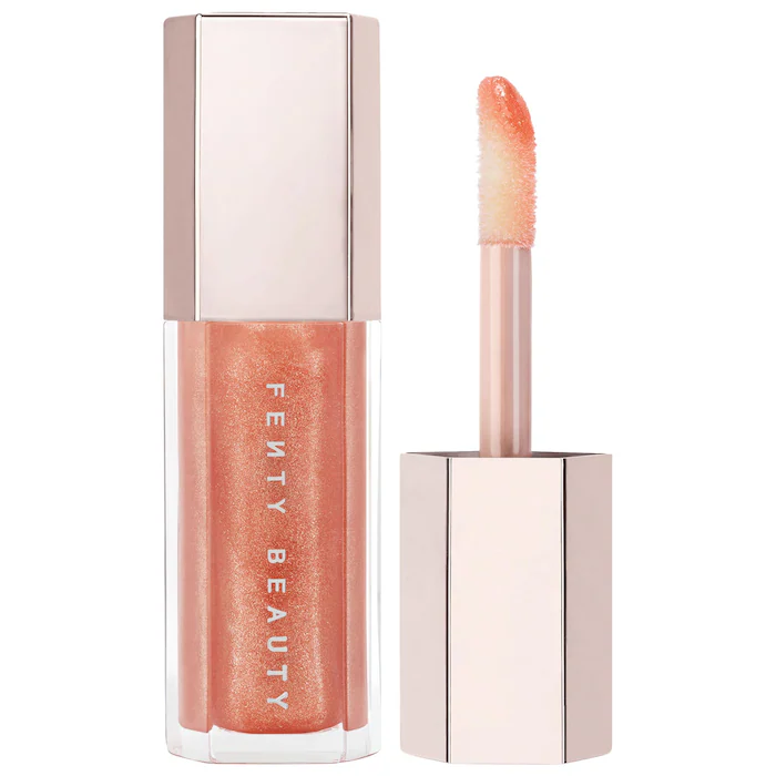 Fenty Beauty by Rihanna Gloss Bomb Universal Lip Luminizer -Champ Stamp Fantasy – shimmering holographic gold pearl
